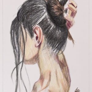 Rear view of a woman with dark hair in a bun, bare shoulders, reaching to touch her hair.